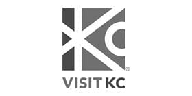 A black and white logo of the kansas city tourism.