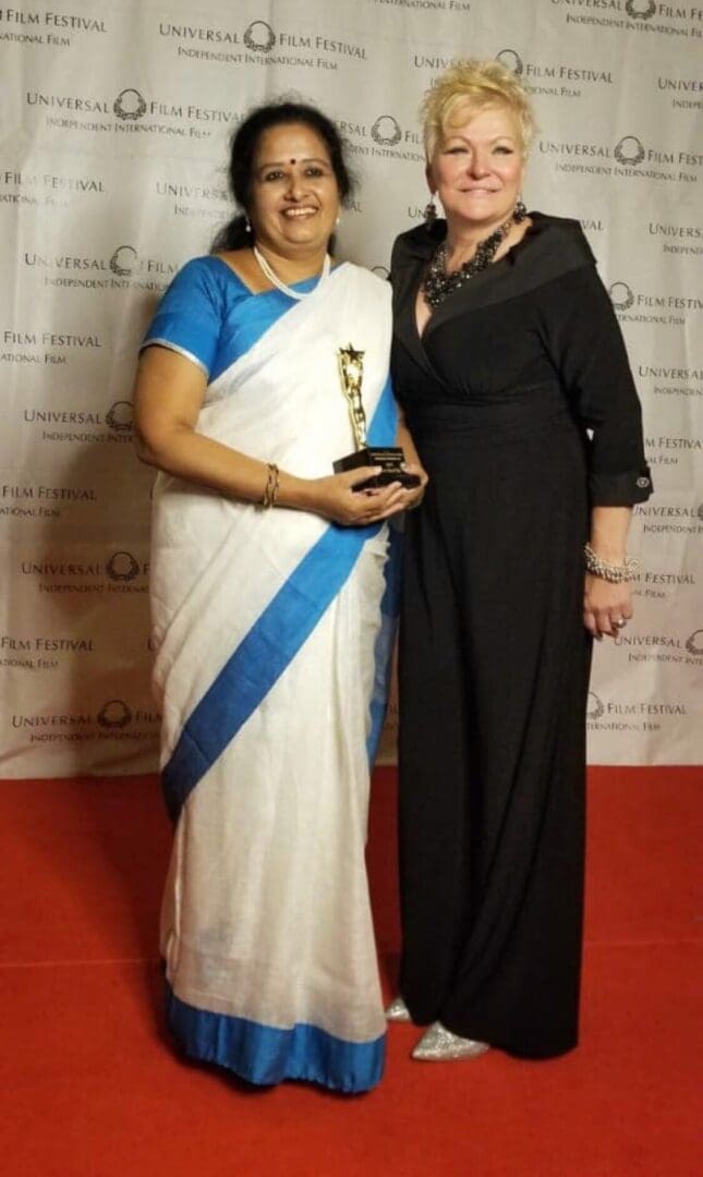 Two women in black and white dresses posing for a picture.